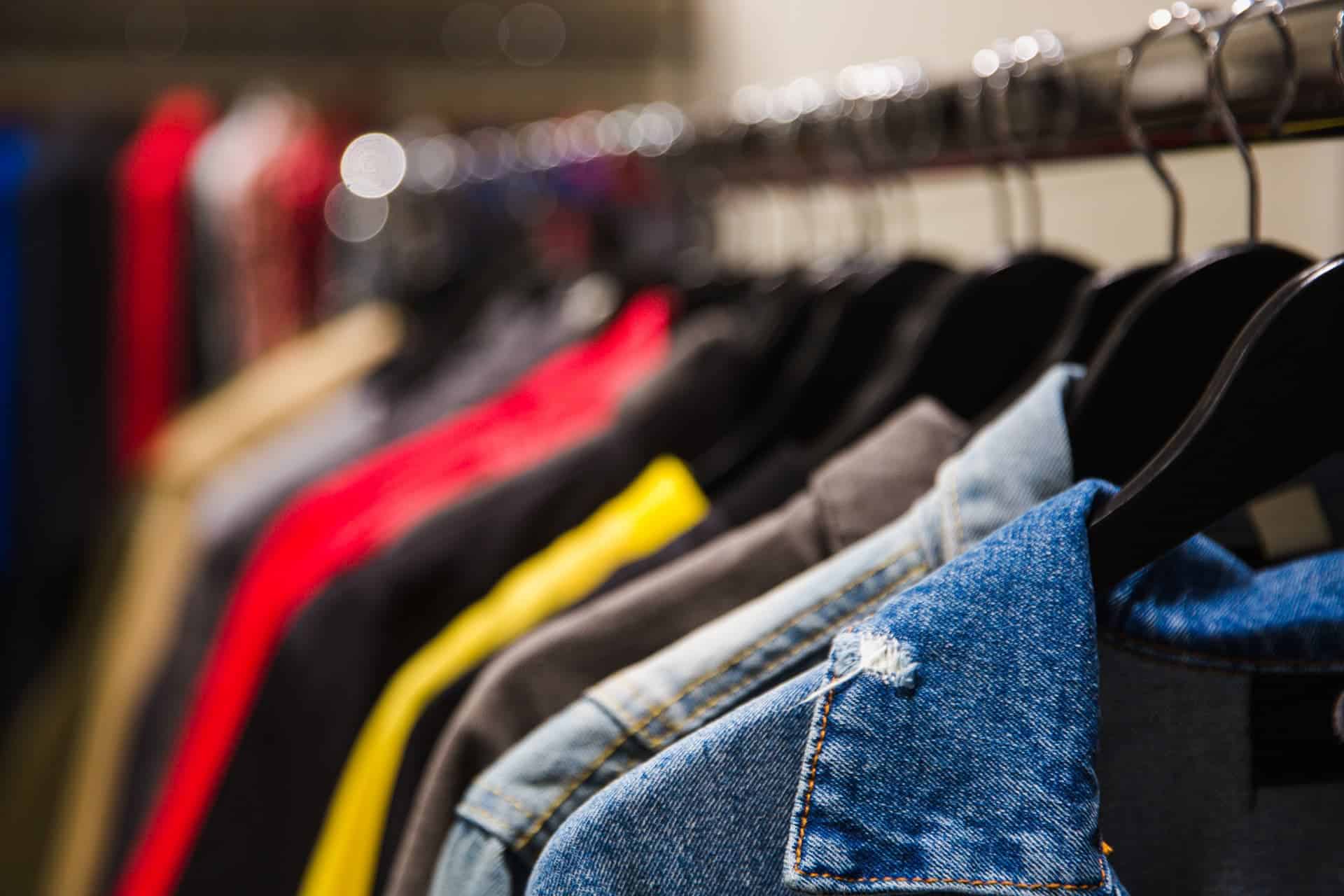 different clothes on hangers close up